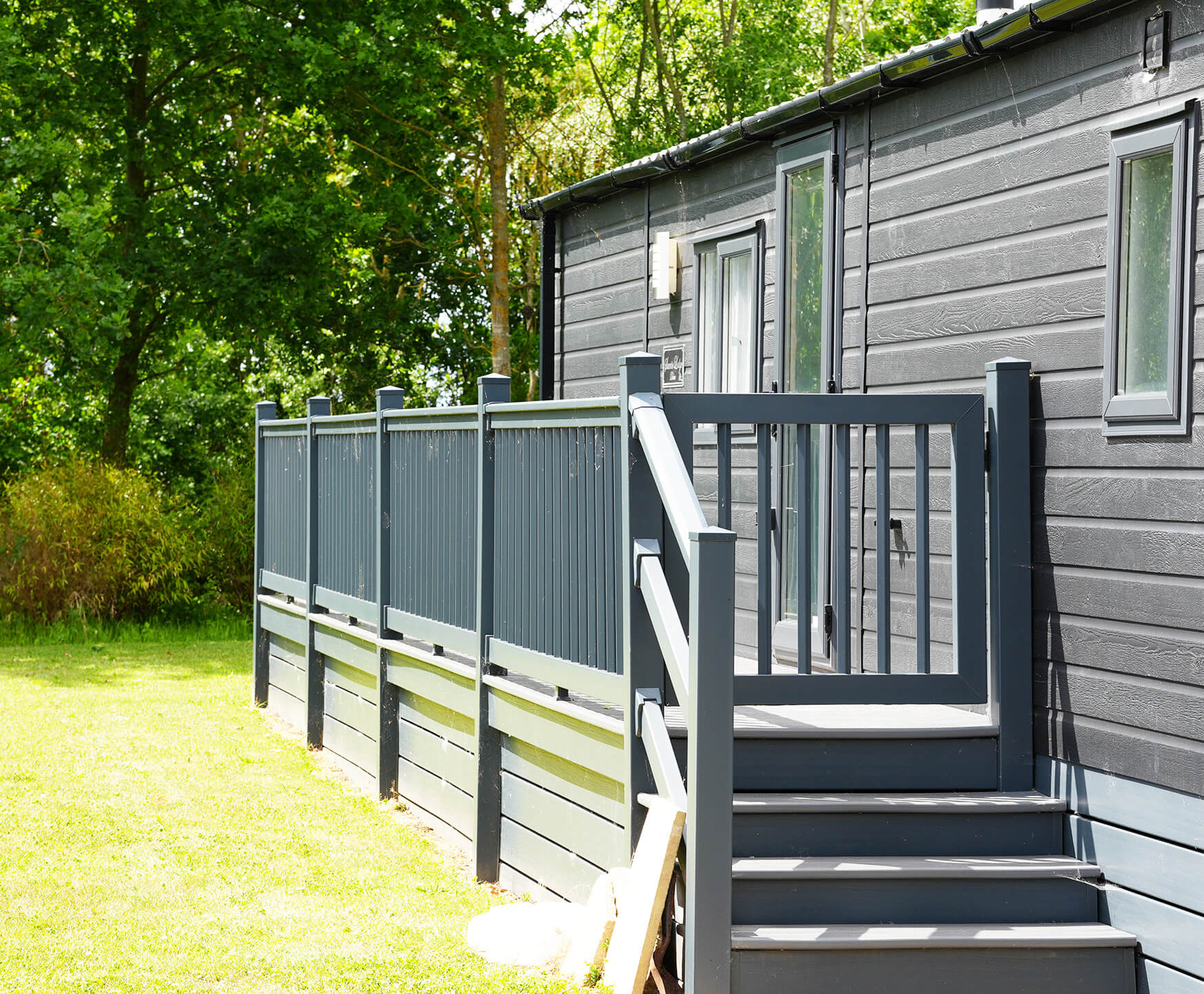 Grey-clad lodge with railed decking, lodges for sale near Gainsborough