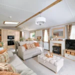 ABI Ambleside lounge with two free-standing sofas, upholstered footstool and a wood-burner-style feature fire